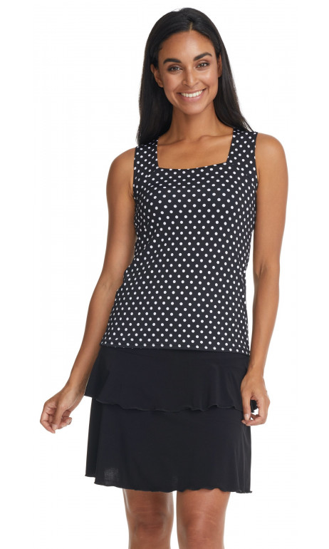 White polka dot camisole on a black background